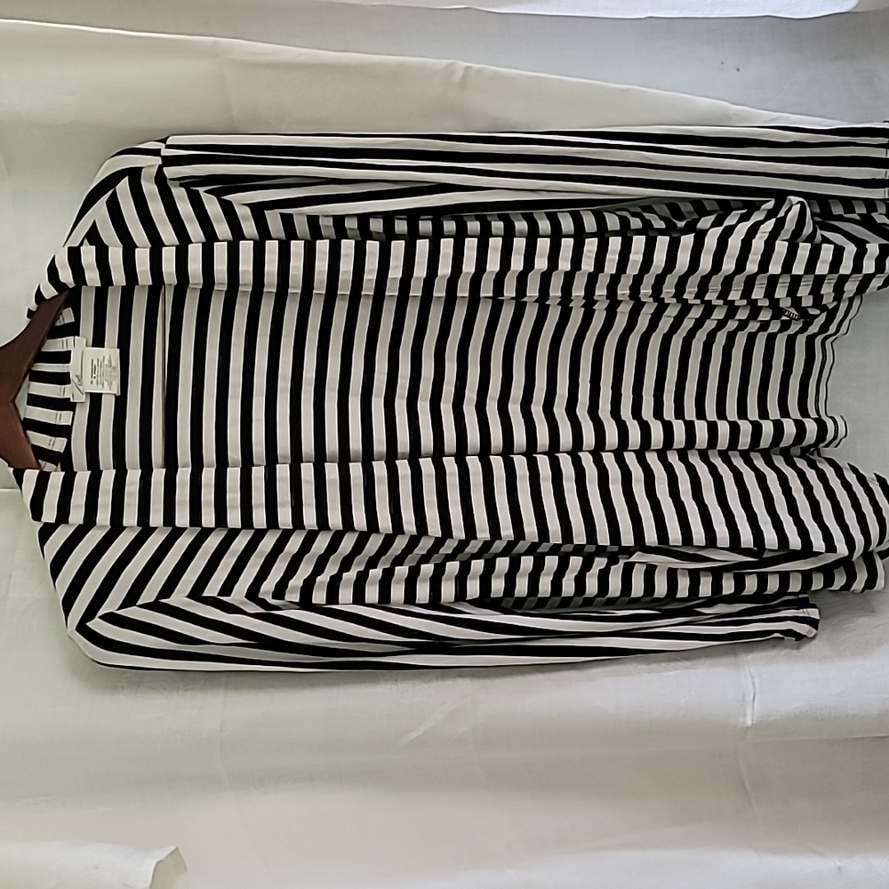 Black and white striped shrug, size XL, used in good condition.